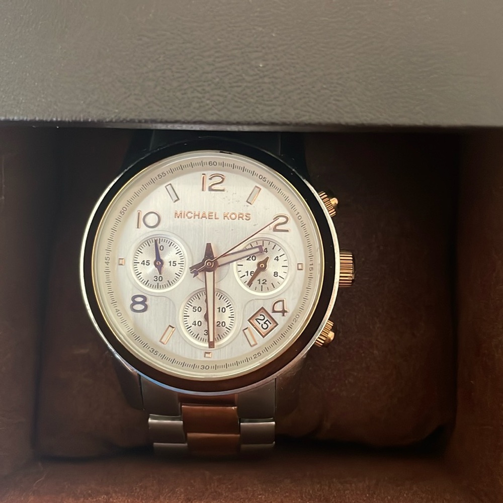 Rose gold and stainless steel Michael Kors watch.  Used and very little wear.